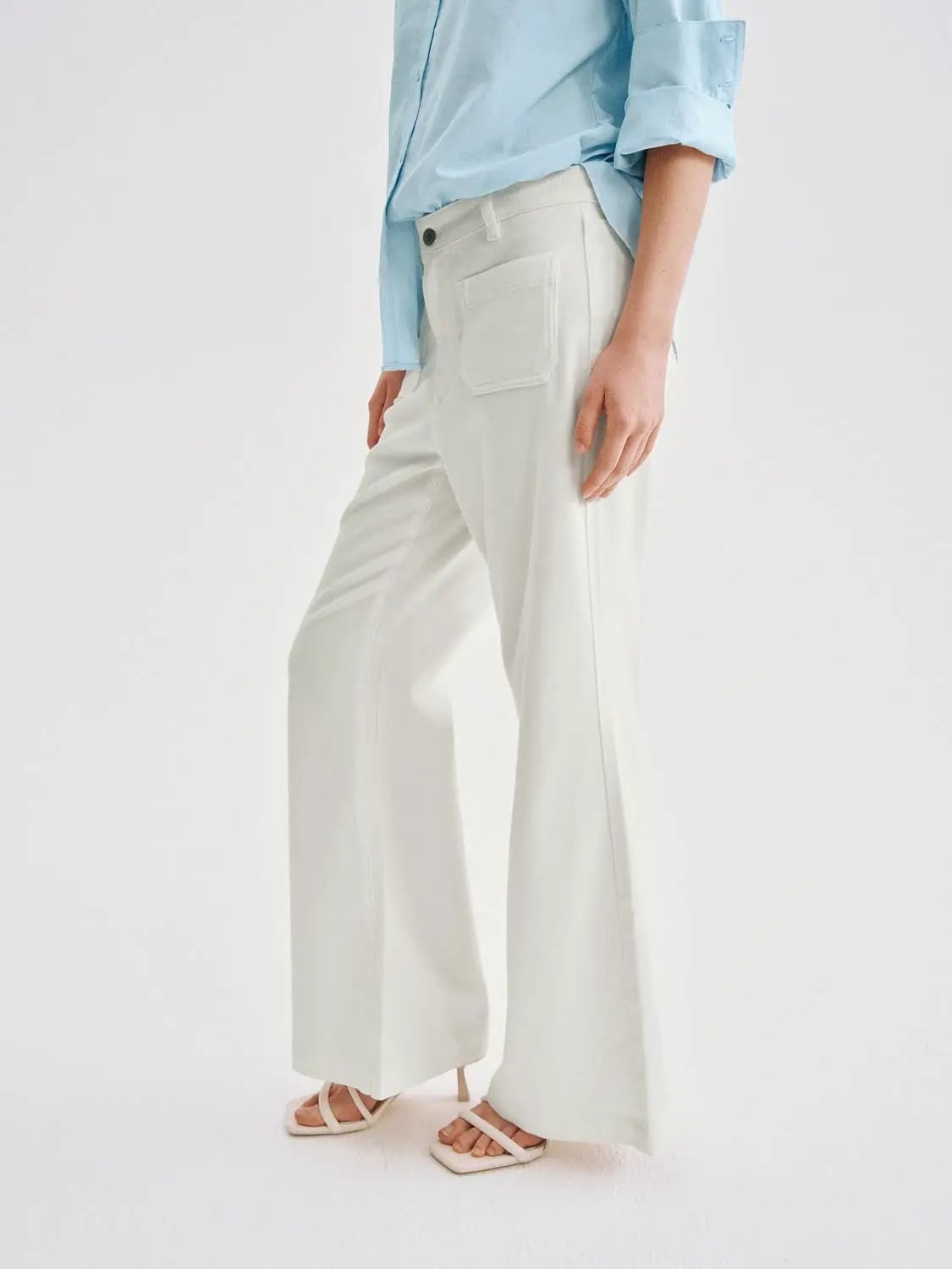 Casual wide-leg cotton-lyocell blend pants in cream with belt loops and back patch pocket.