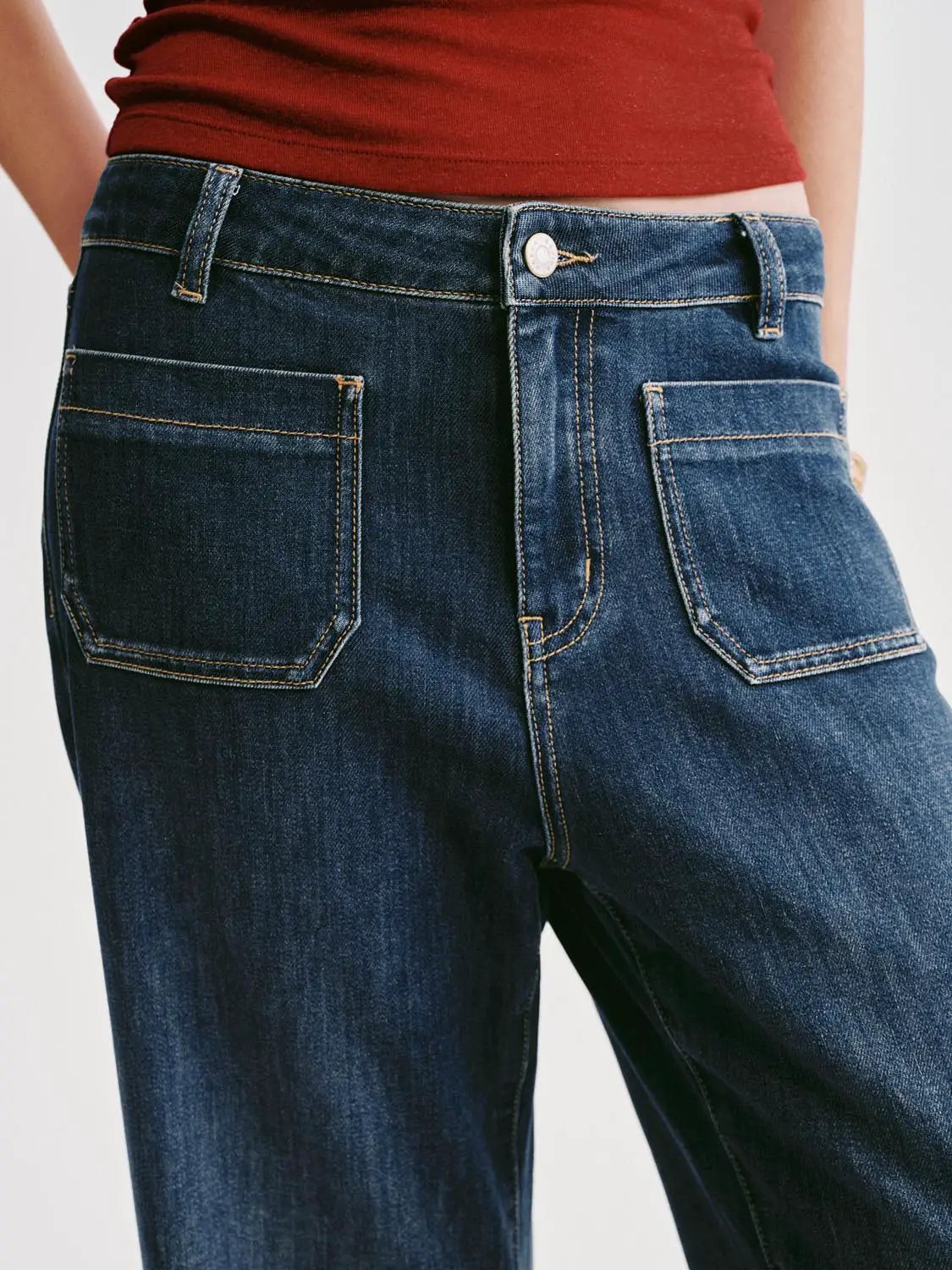 High-waisted patch-pocket wide-leg jeans in dark indigo denim.