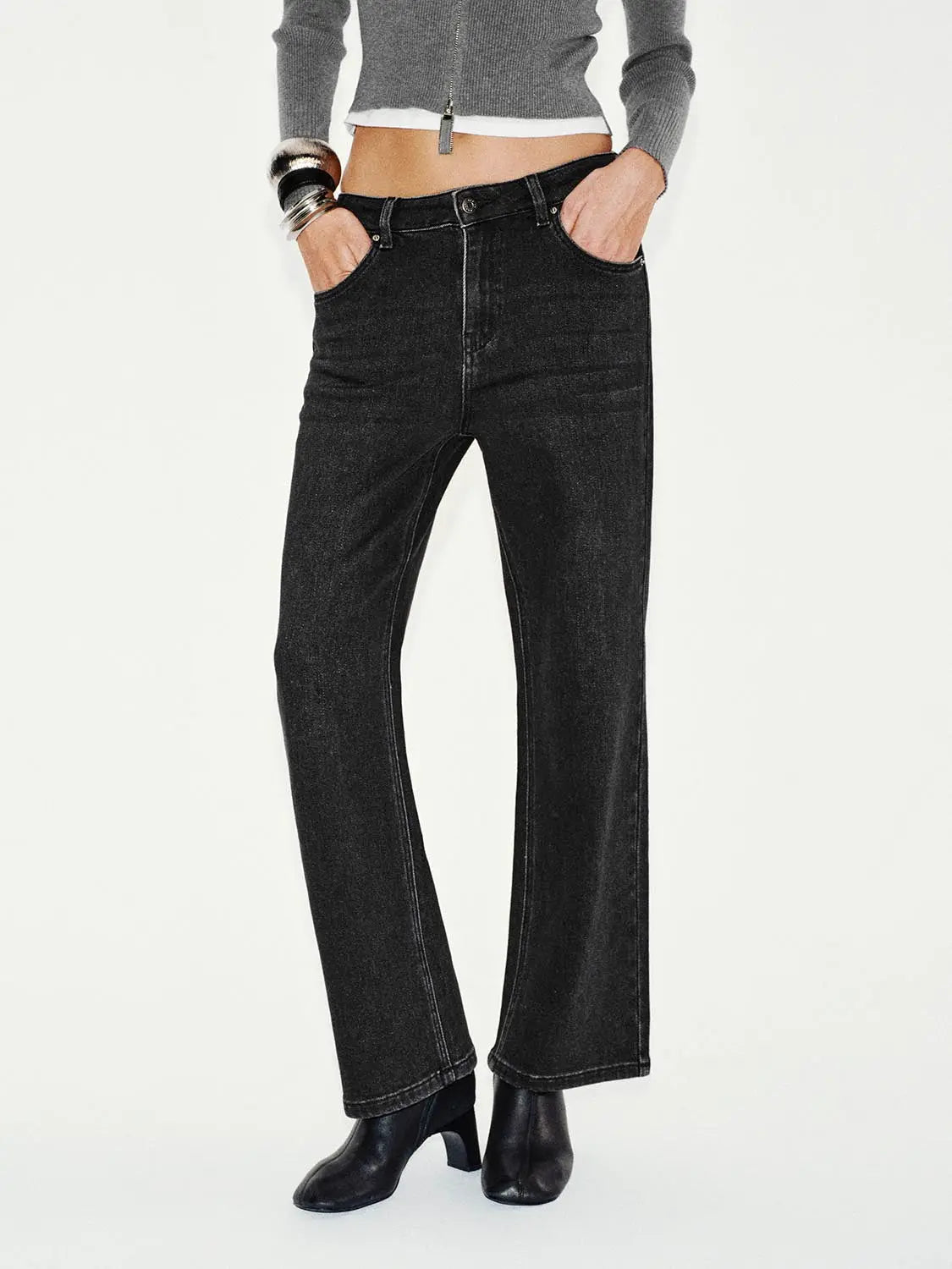 Jeans, black denim with visible contrast stitching, straight-leg ankle-length fit