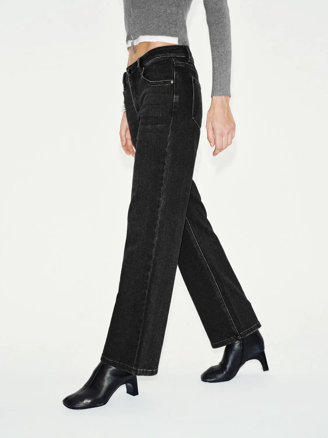 Jeans, black denim with a wide-leg cut and visible contrast stitching