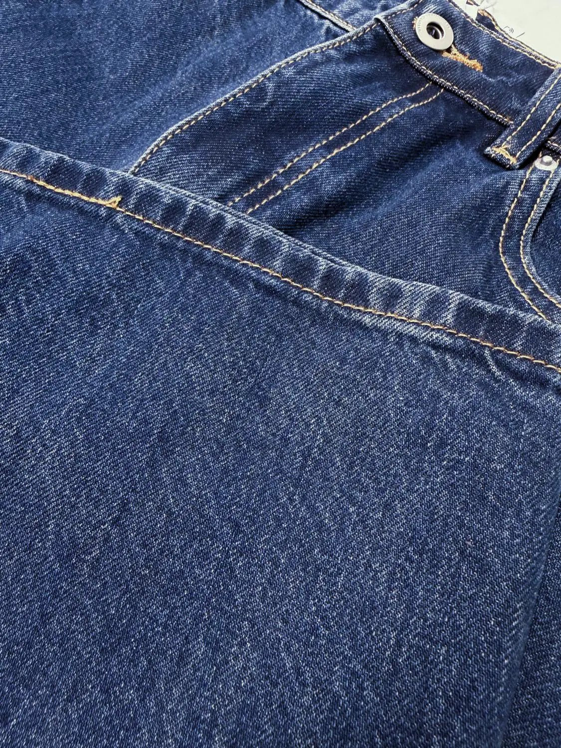 Jeans by Urban Revivo Fashion; blue denim with tan contrast stitching and metal button.
