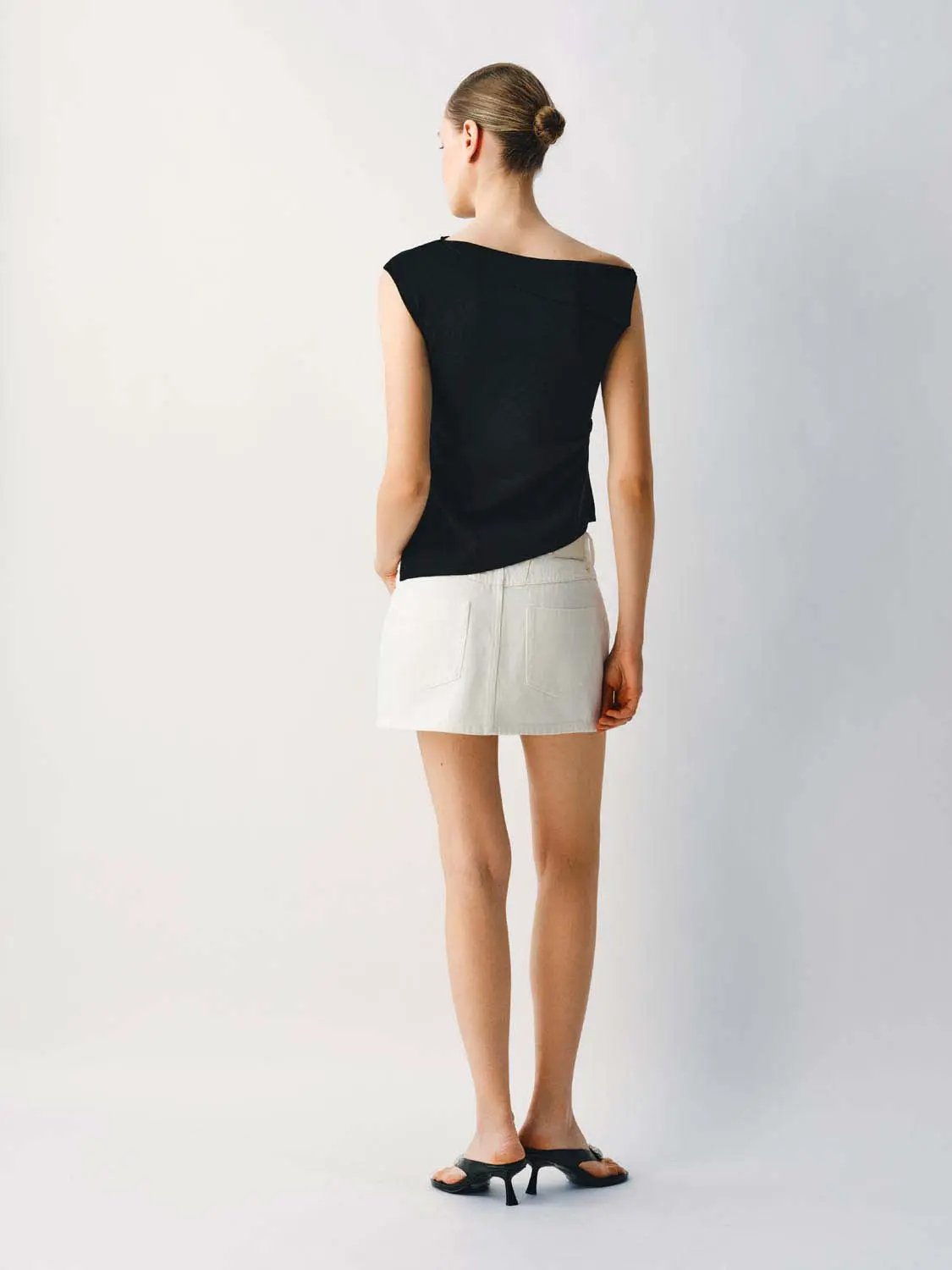 Medium Stretch T-Shirt, black one-shoulder knit top paired with white mini skirt