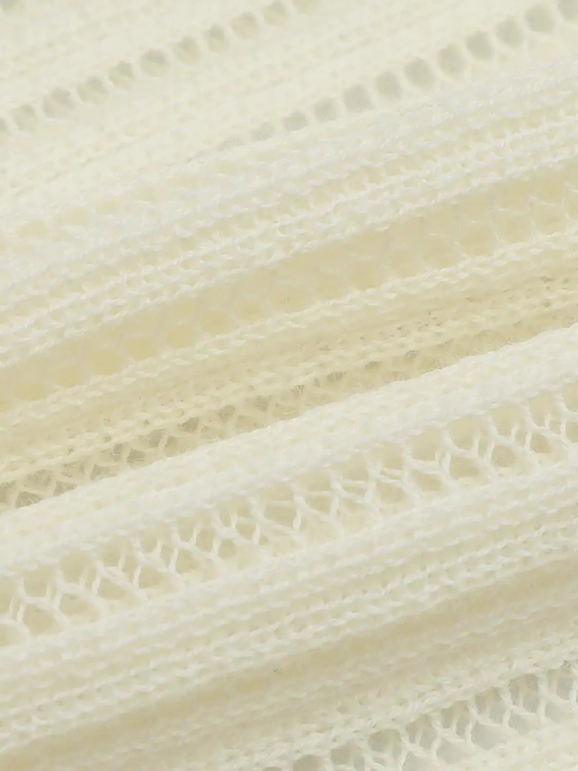 Knit T-Shirt ivory cream knit close-up with soft open-knit texture.