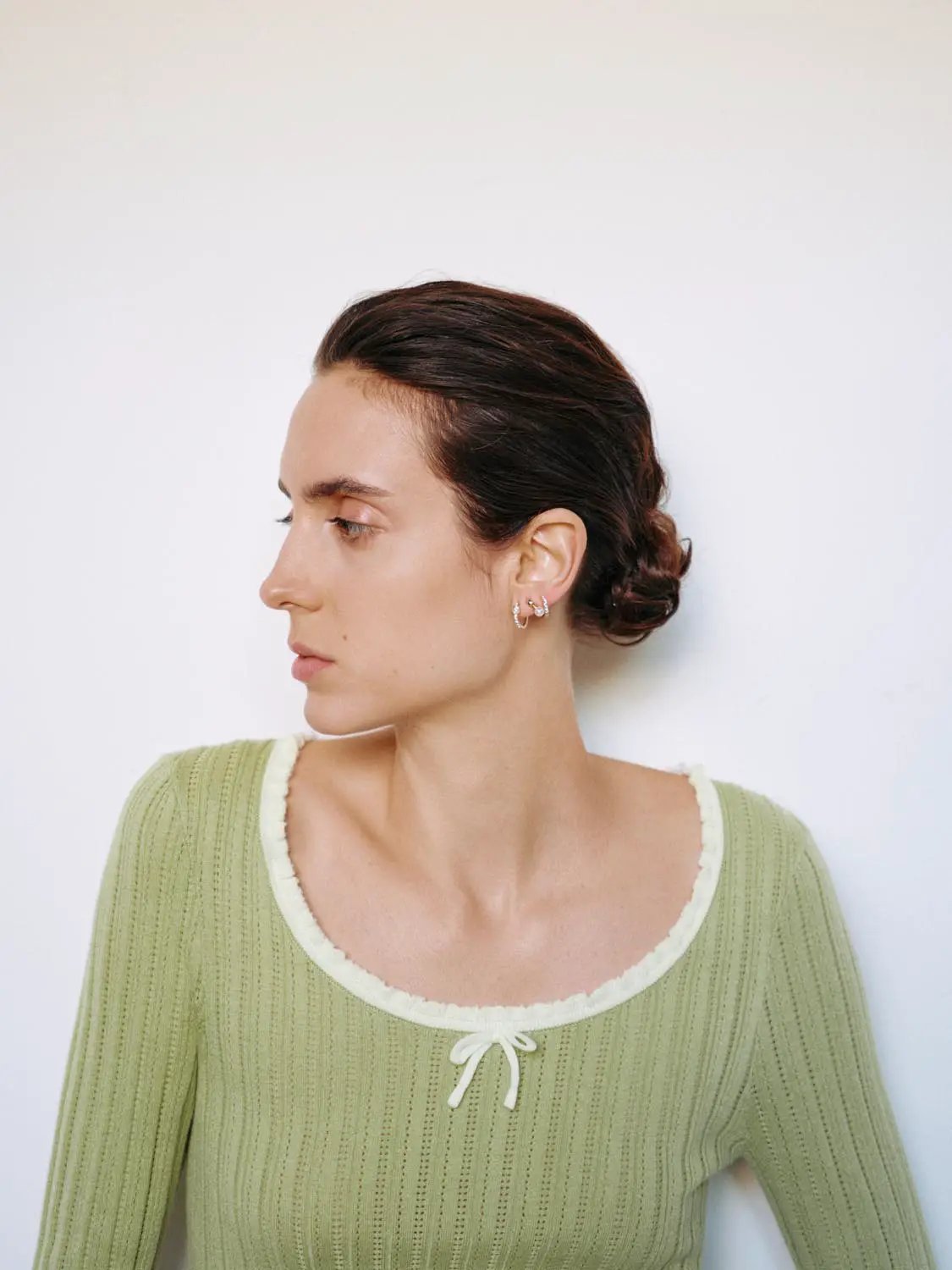 Ribbed square-neck long-sleeve knit T-shirt in olive green with white-trim bow detail at neckline