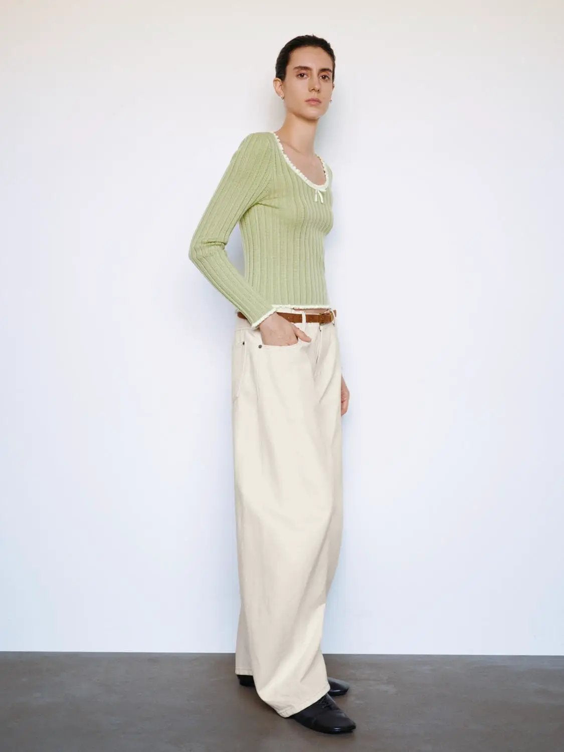 Ribbed square-neck long-sleeve knit T-shirt in pale green with white trim and a small bow.