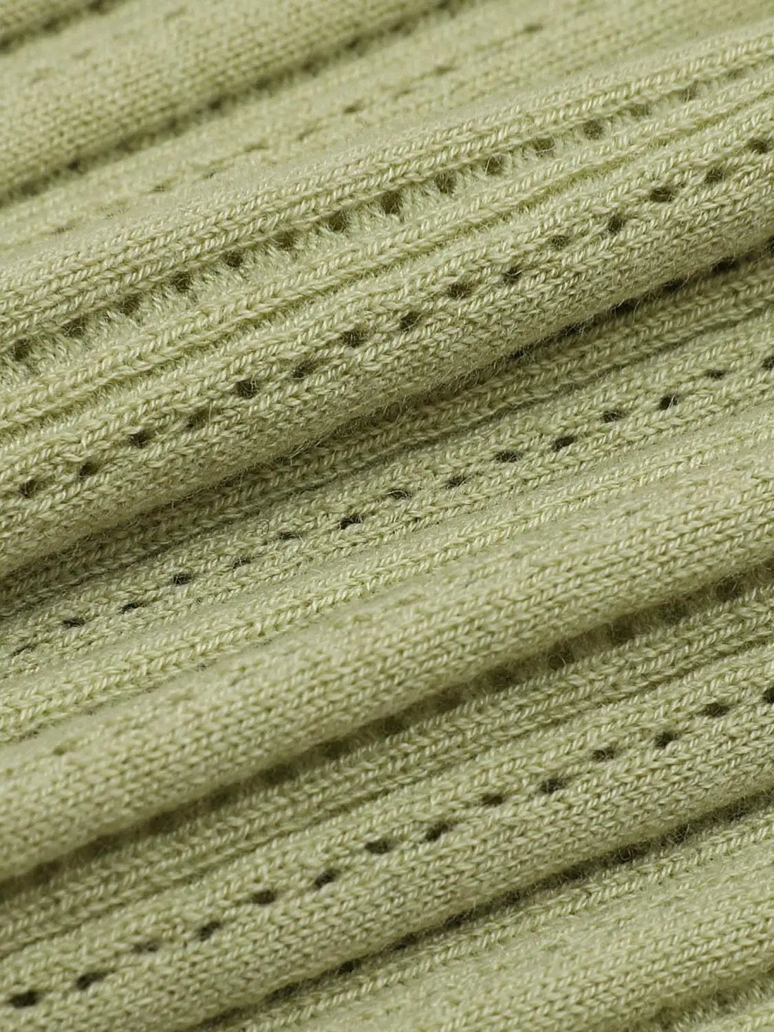 Ribbed knit T-shirt fabric in olive green; close-up texture with fine ridges