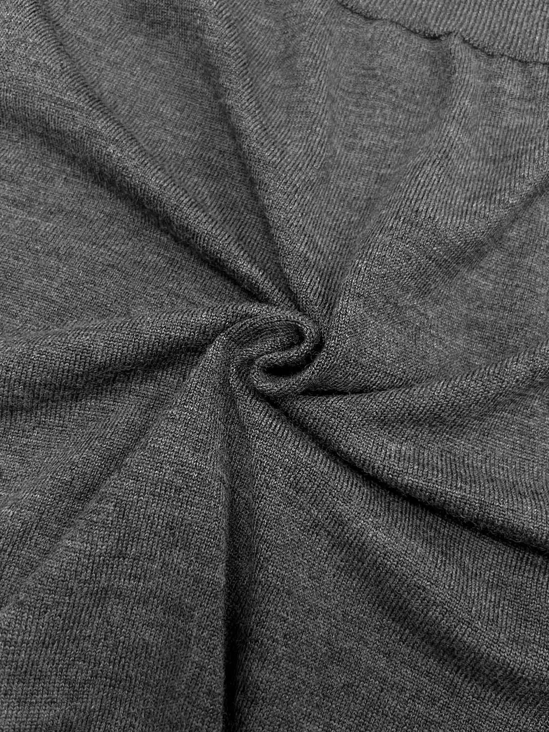 Knitted cardigan fabric in gray with close-up knit texture