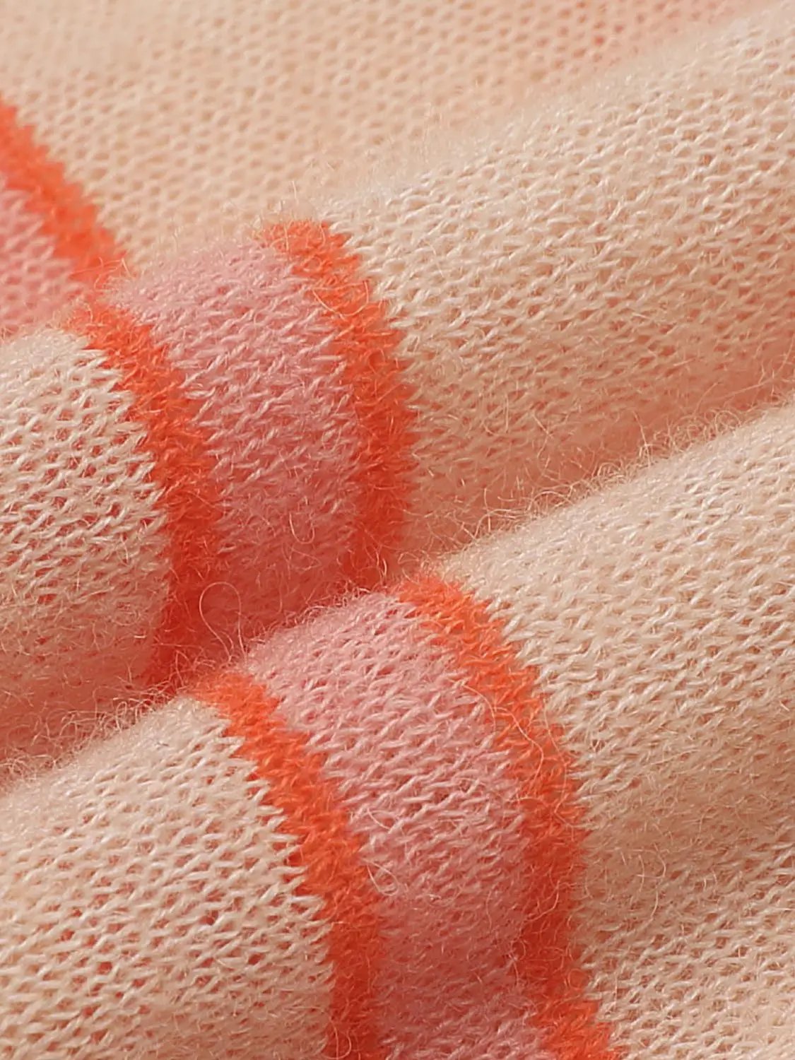 Knit T-Shirt fabric close-up in blush pink with coral stripe detail