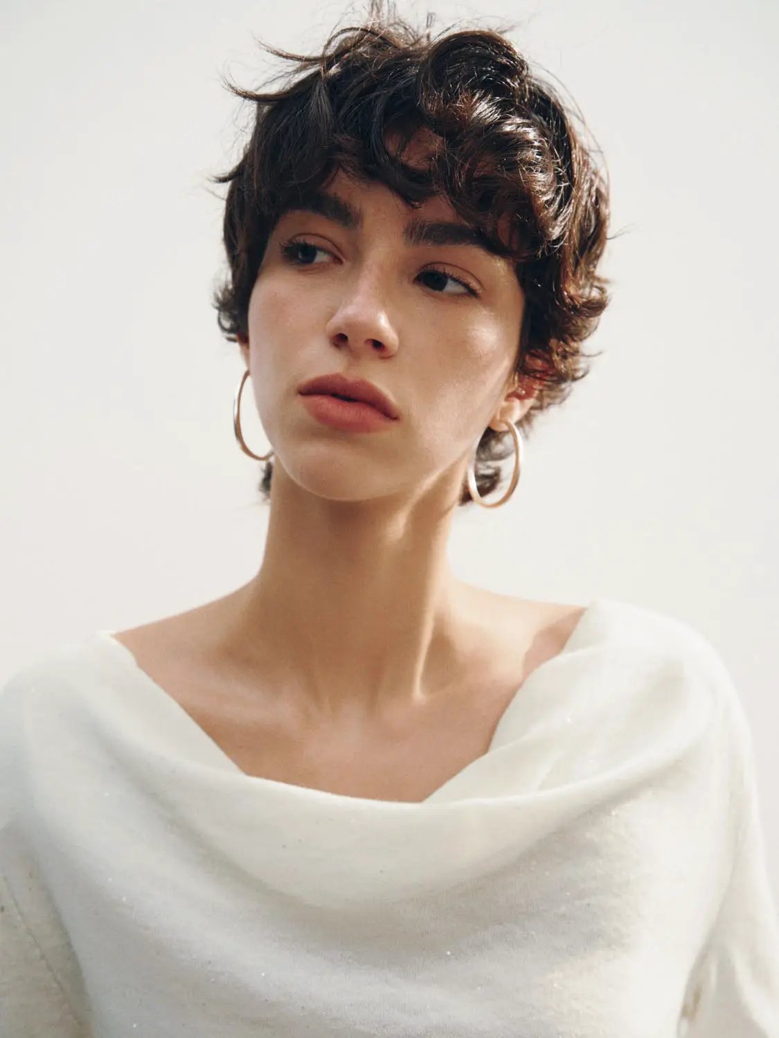 Knit T-Shirt white knitted top worn by model for a clean minimalist look