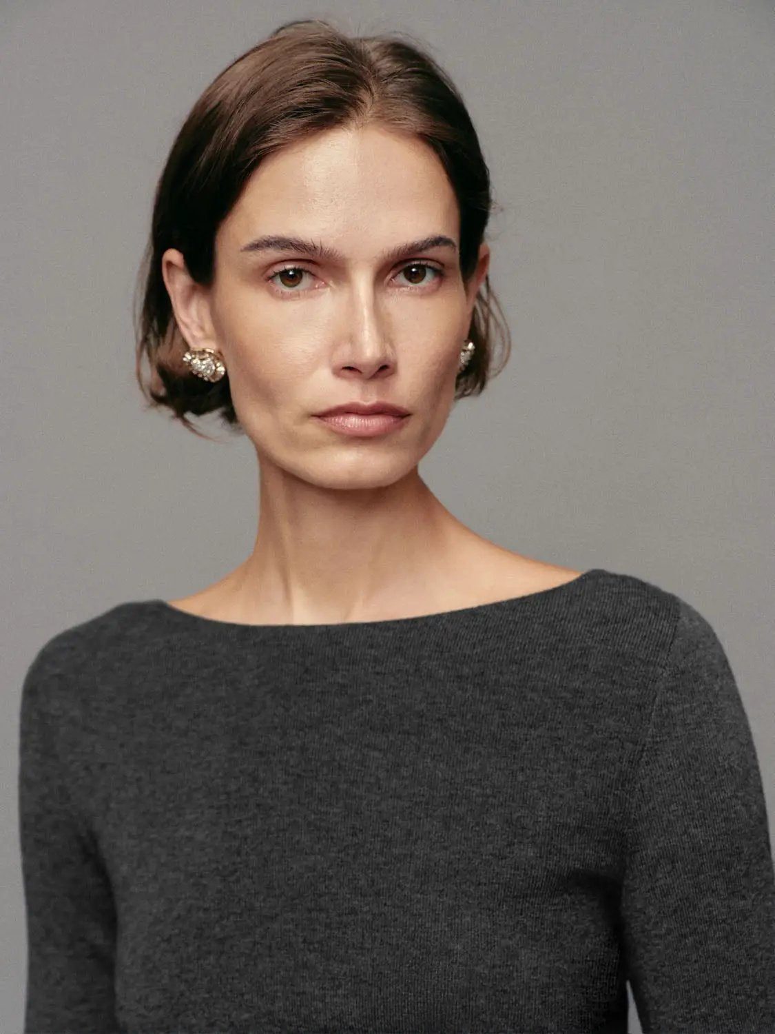 Ribbed long-sleeve boat-neck knit top in charcoal gray.