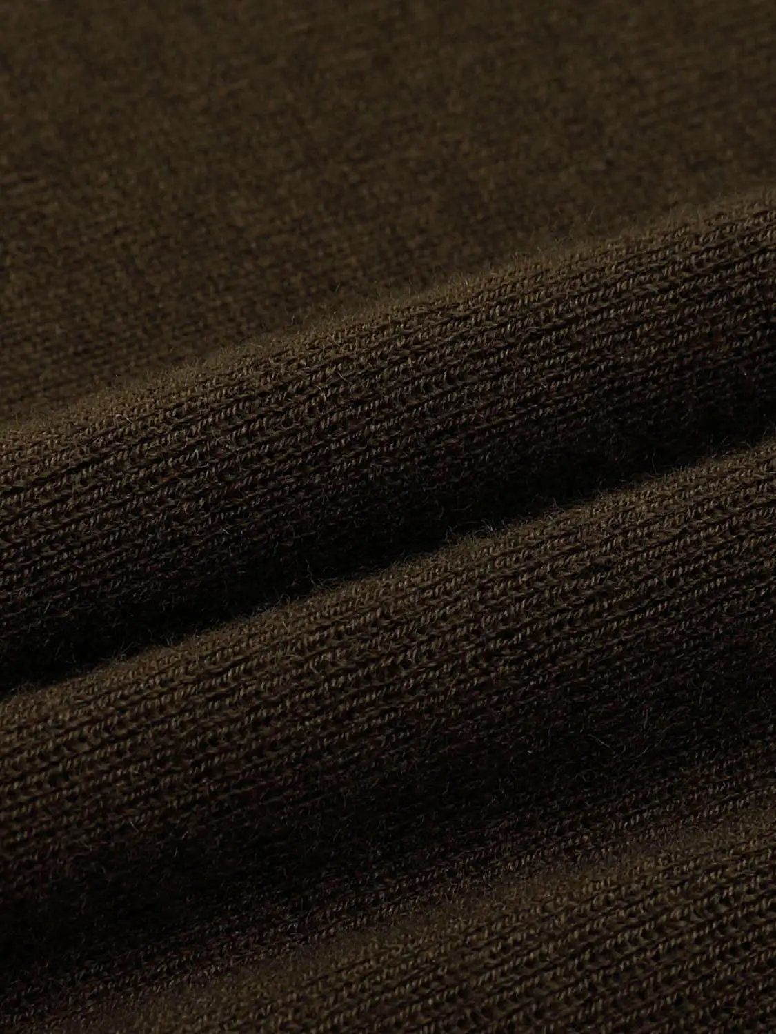Ribbed long-sleeve boat-neck knit top close-up in dark brown fabric