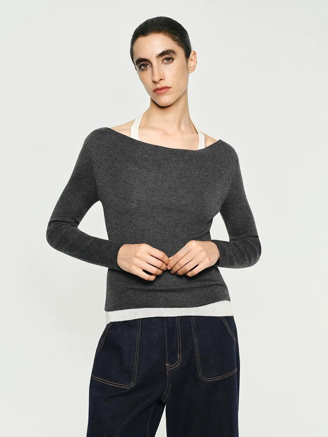 Fitted contrast-hem boat-neck long-sleeve knit top in charcoal grey with white hem.