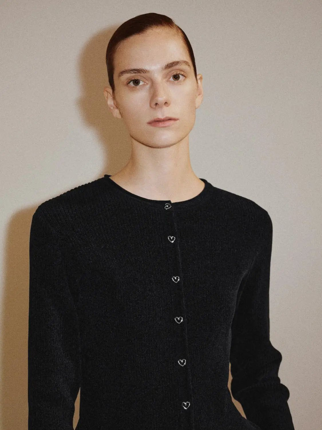 Ribbed heart-button crew-neck long-sleeve cardigan in black with heart-shaped front buttons