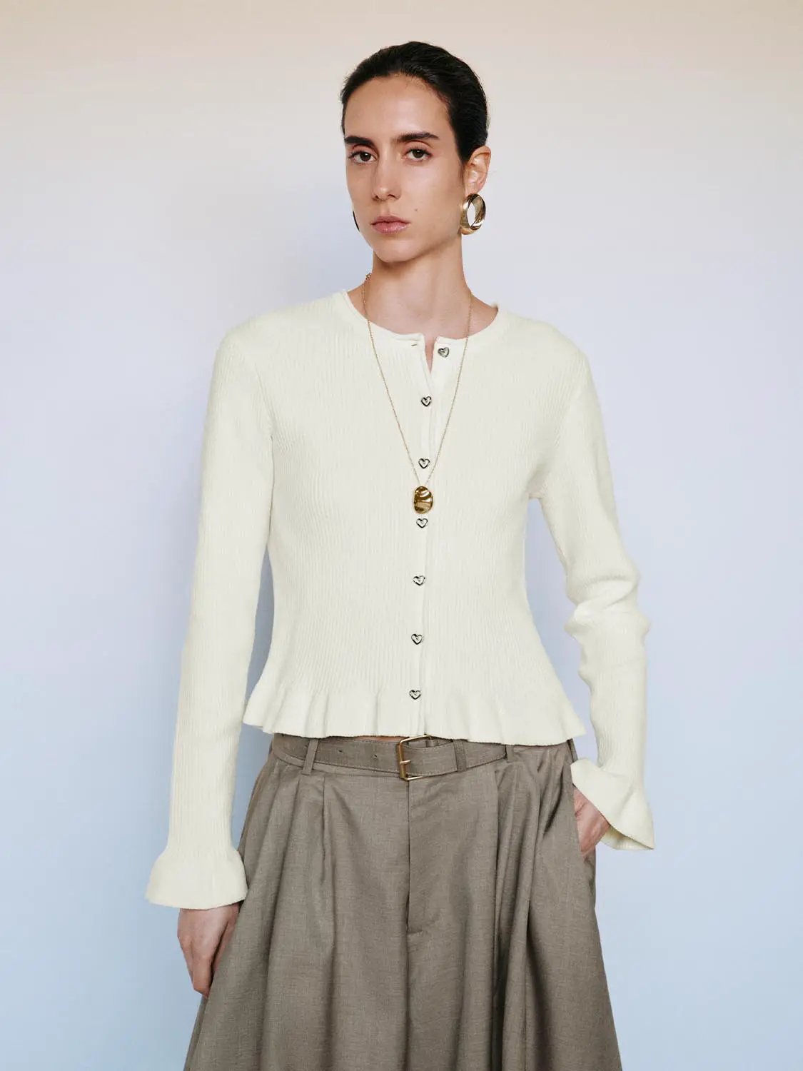 Ribbed Heart Button Crew Neck Long Sleeve Cardigan in white knit, featuring heart-shaped buttons and a subtle ruffle hem