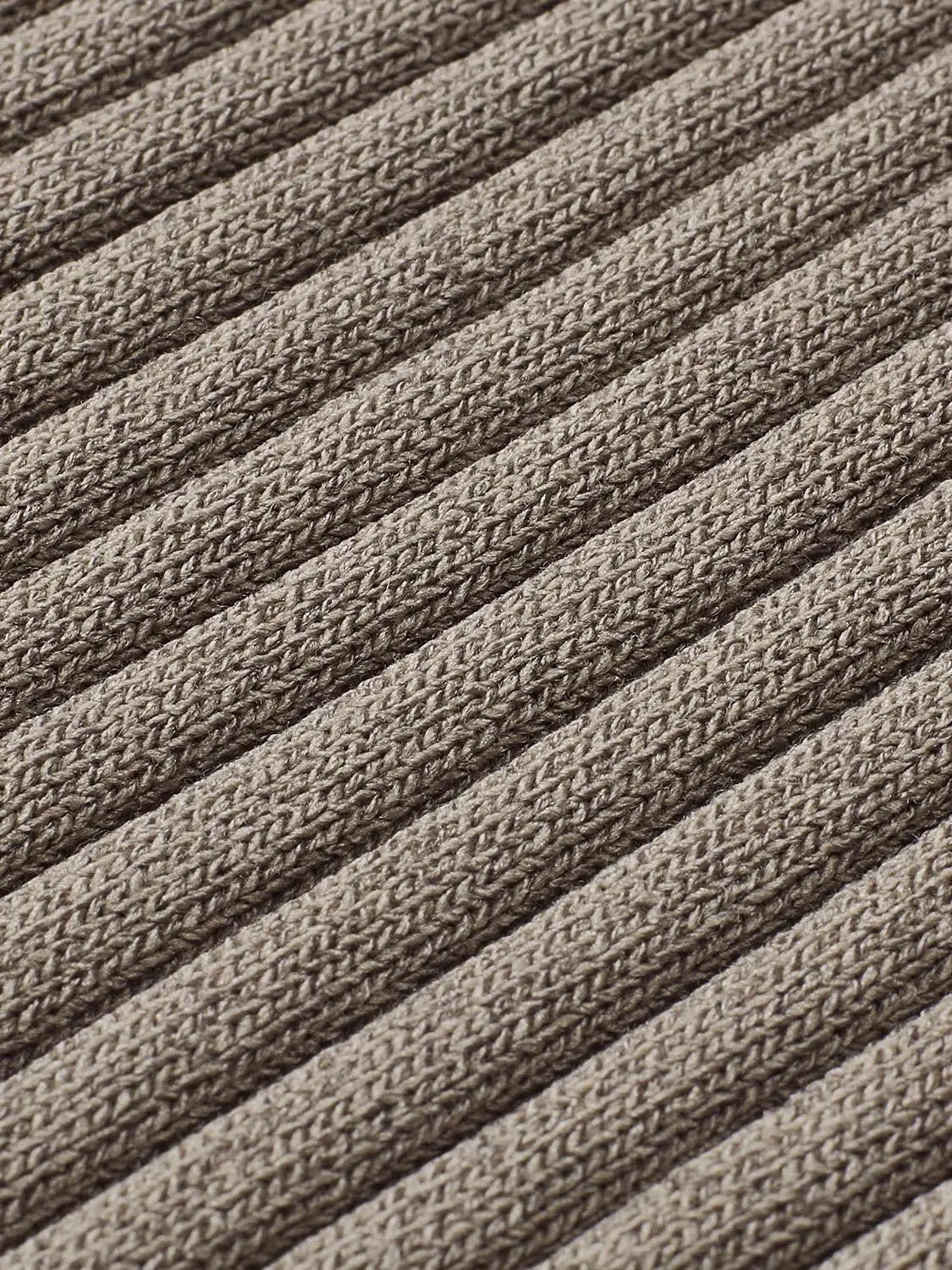 Knitted T-shirt fabric in beige-brown ribbed knit with close-up texture.