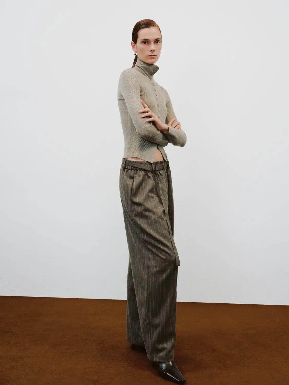 Ribbed Slim Mock Neck Long Sleeve Button Front Knit Jacket in beige; cropped waist-length fit.