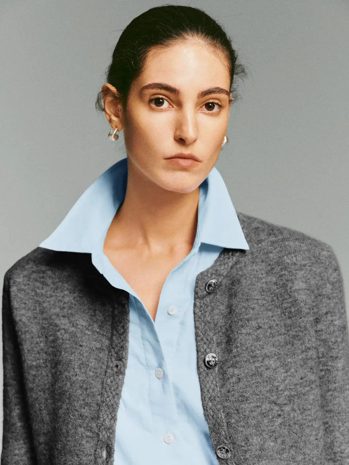 Urban Revivo Fashion Crew Neck Button Front Long Sleeve Knitwear Jacket in grey knit, layered over a light blue shirt