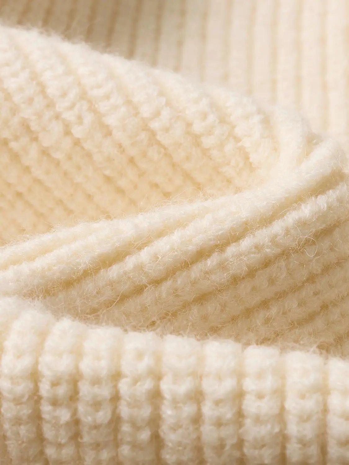 Knit Top in cream ribbed knit with soft, fuzzy texture, close-up fabric detail.