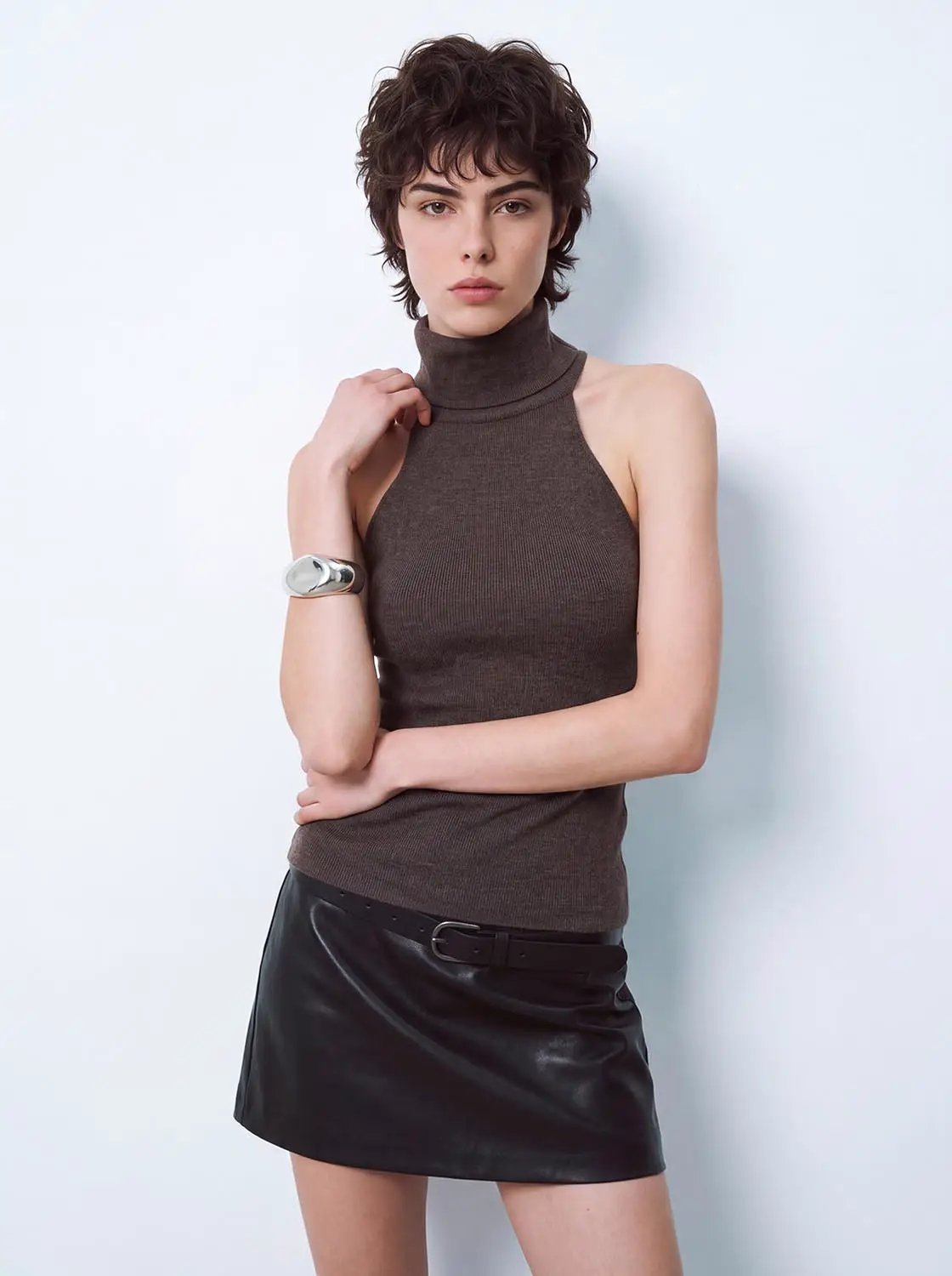 Knit T-Shirt in brown, sleeveless high-neck knitted top worn with a black leather mini skirt