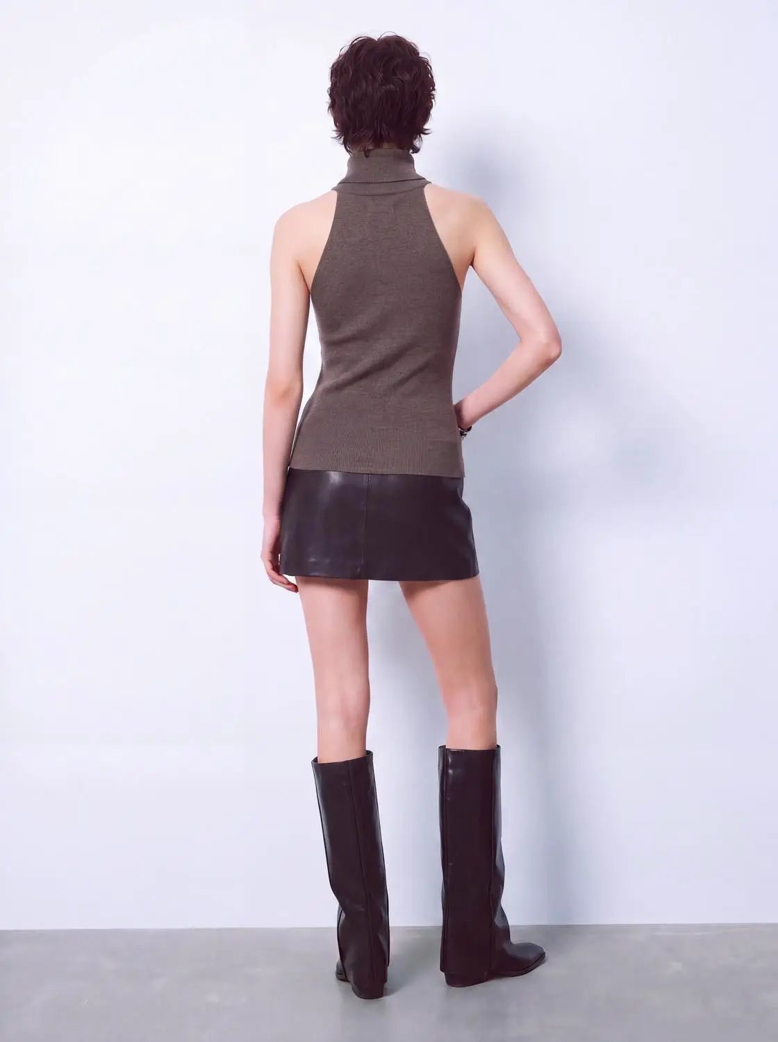Knit T-Shirt: taupe sleeveless knitted turtleneck top, back view.