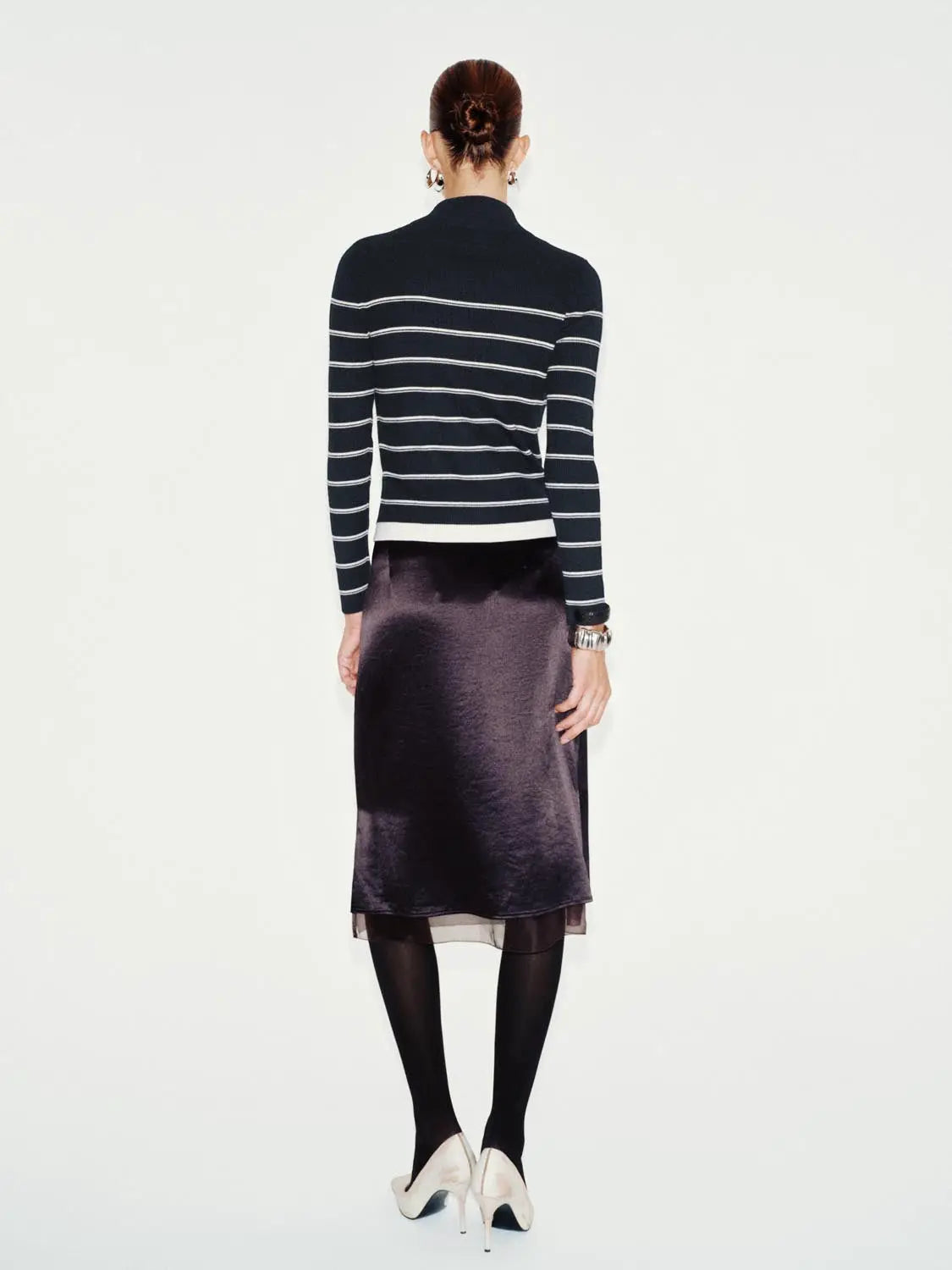 Knit jacket in navy with white horizontal stripes, back view.