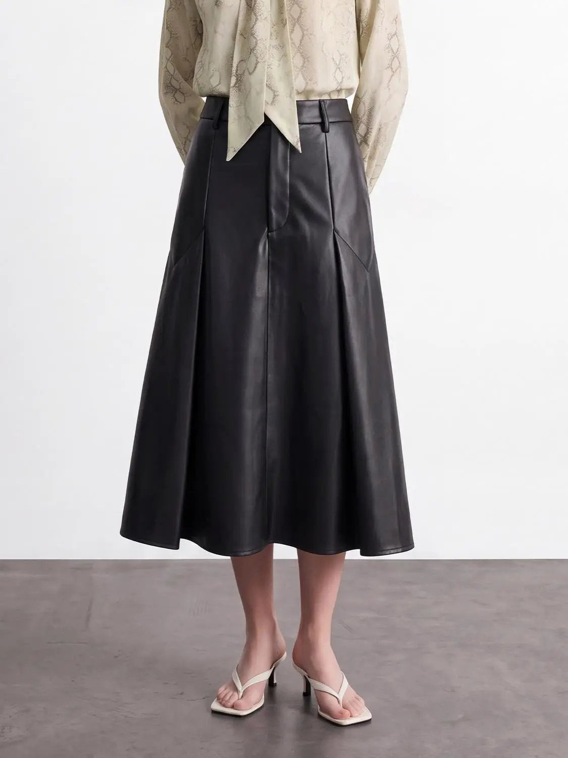 Pleated vegan leather A-line skirt, black, midi length, Urban Revivo Fashion.