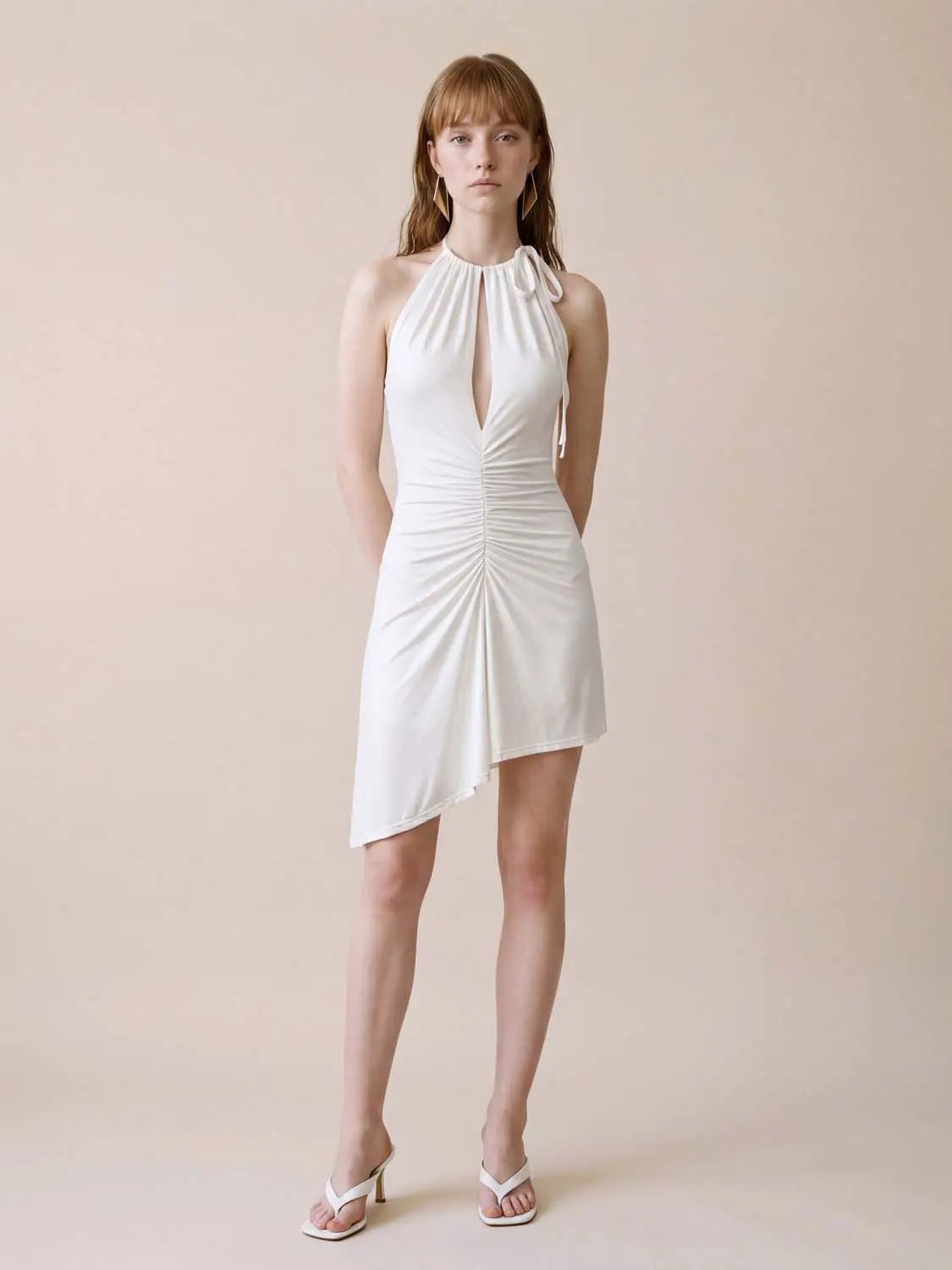 A-Line dress, white satin halter-neck with center ruching and asymmetrical hem.