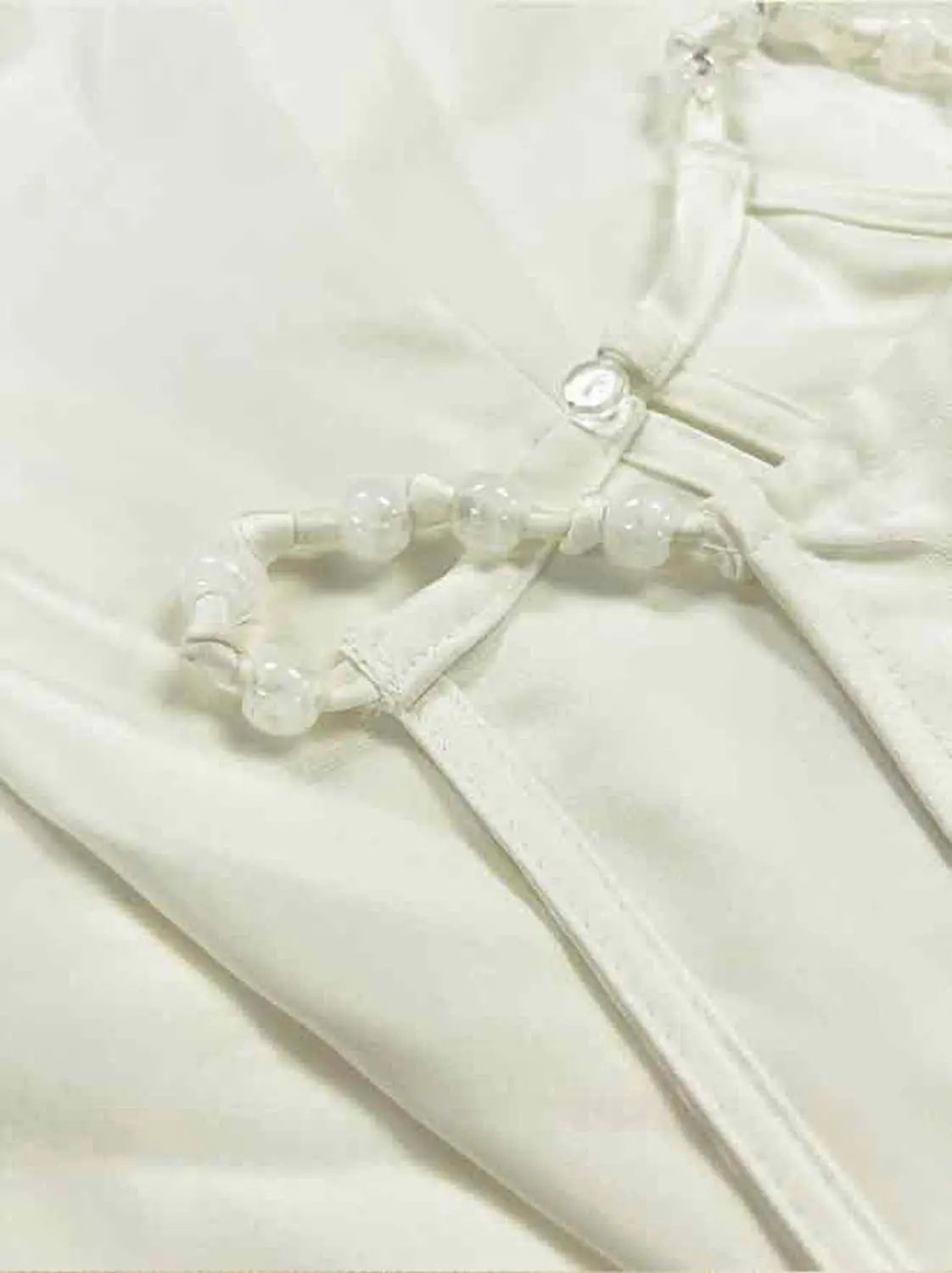 A-Line Dress in white with beaded waist belt and zipper closure