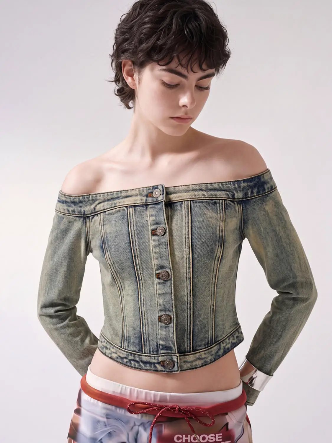 Long sleeve off-shoulder washed denim cropped top with button-down front in light blue