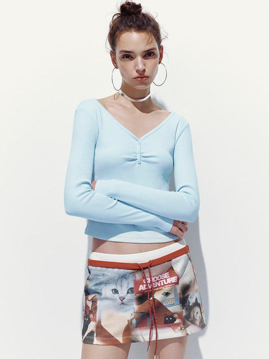 Camisetas de manga larga con cuello en V y botón superior