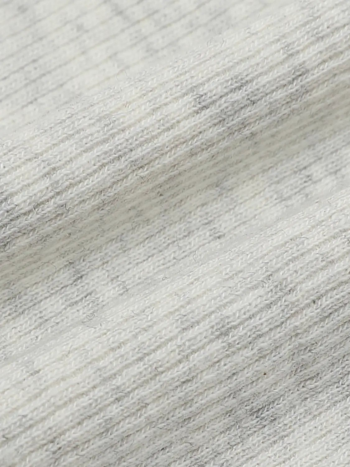 T-Shirt fabric close-up in light gray heather knit with soft cotton-like texture