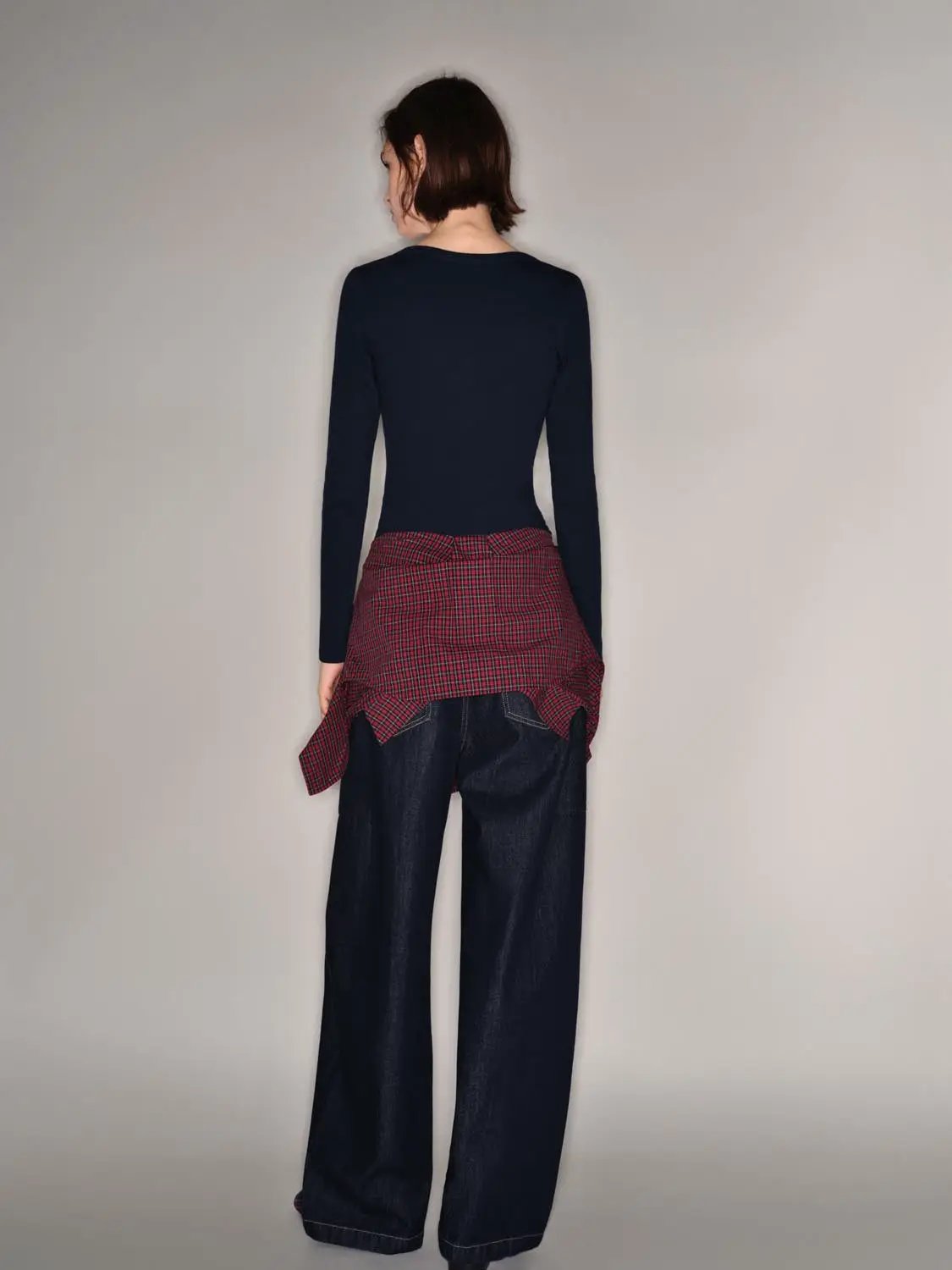 T-Shirt by Urban Revivo Fashion, navy long-sleeve top with red plaid shirt tied at waist and dark wide-leg jeans