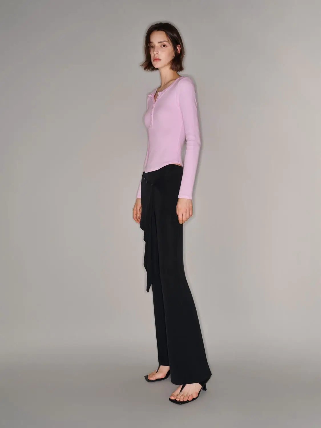 Pink long-sleeve T-shirt by Urban Revivo Fashion, worn with black wide-leg pants.