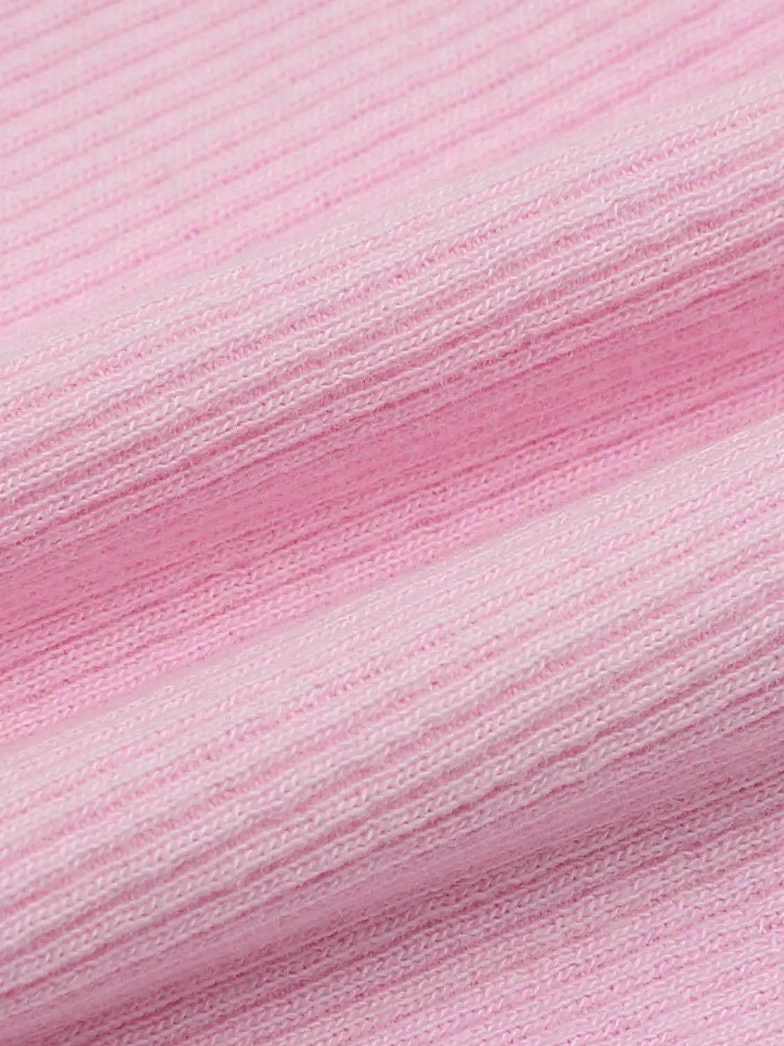 T-shirt fabric in soft pink heather knit texture close-up