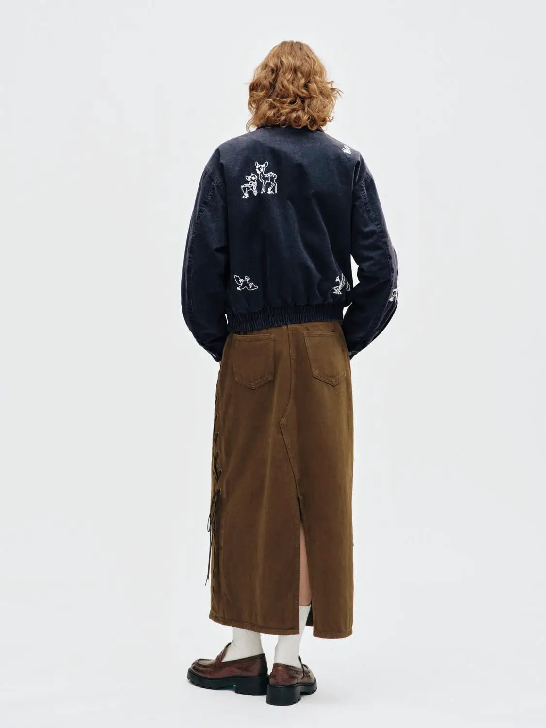 Padded jacket from Urban Revivo in navy with white back embroidery; elastic hem.