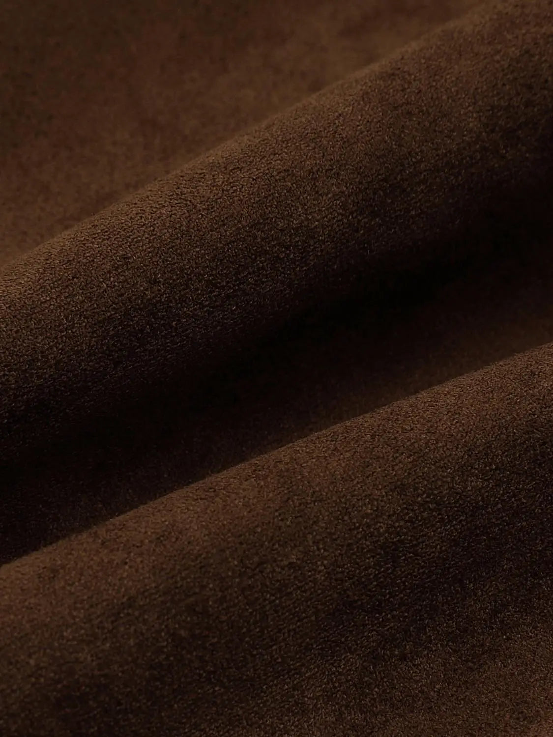 Jacket brown suede fabric close-up with textured nap