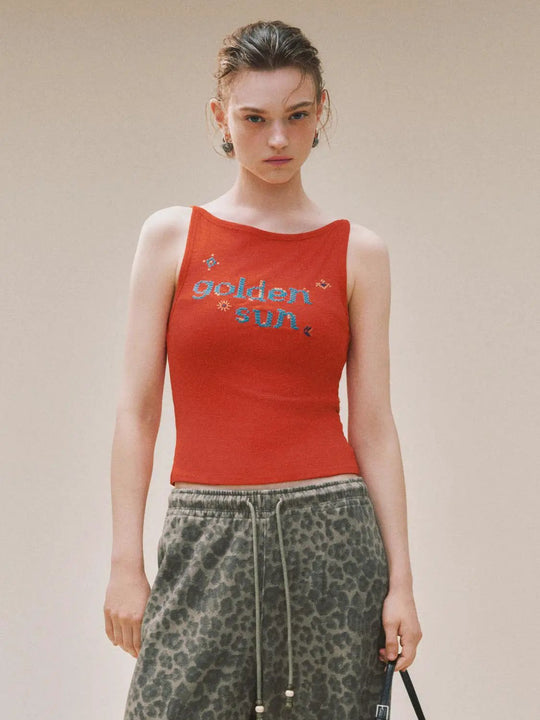 Camiseta de tirantes de canalé con sol dorado bordado
