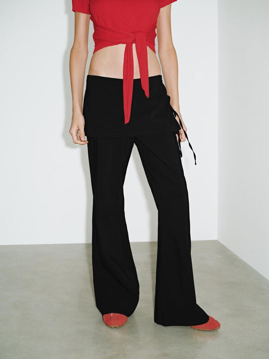 Pantalones acampanados con falda en capas
