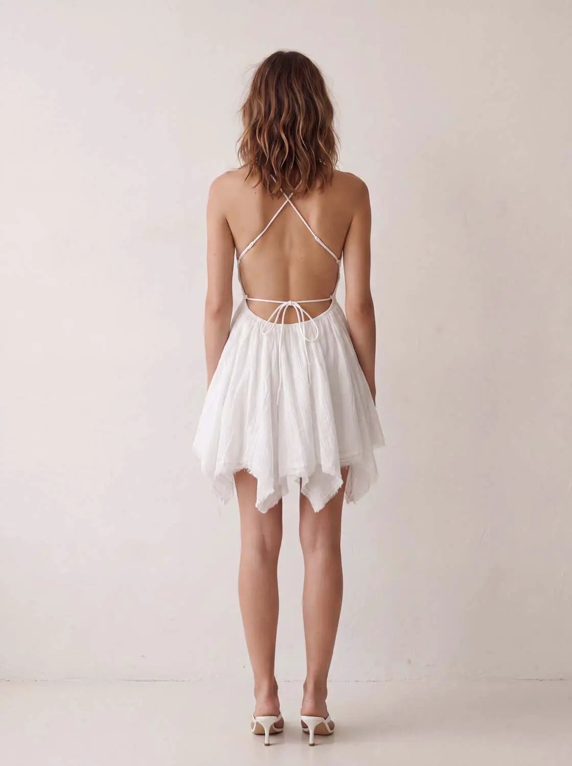 A-Line dress by Urban Revivo Fashion, white backless halter with crisscross straps and waist tie