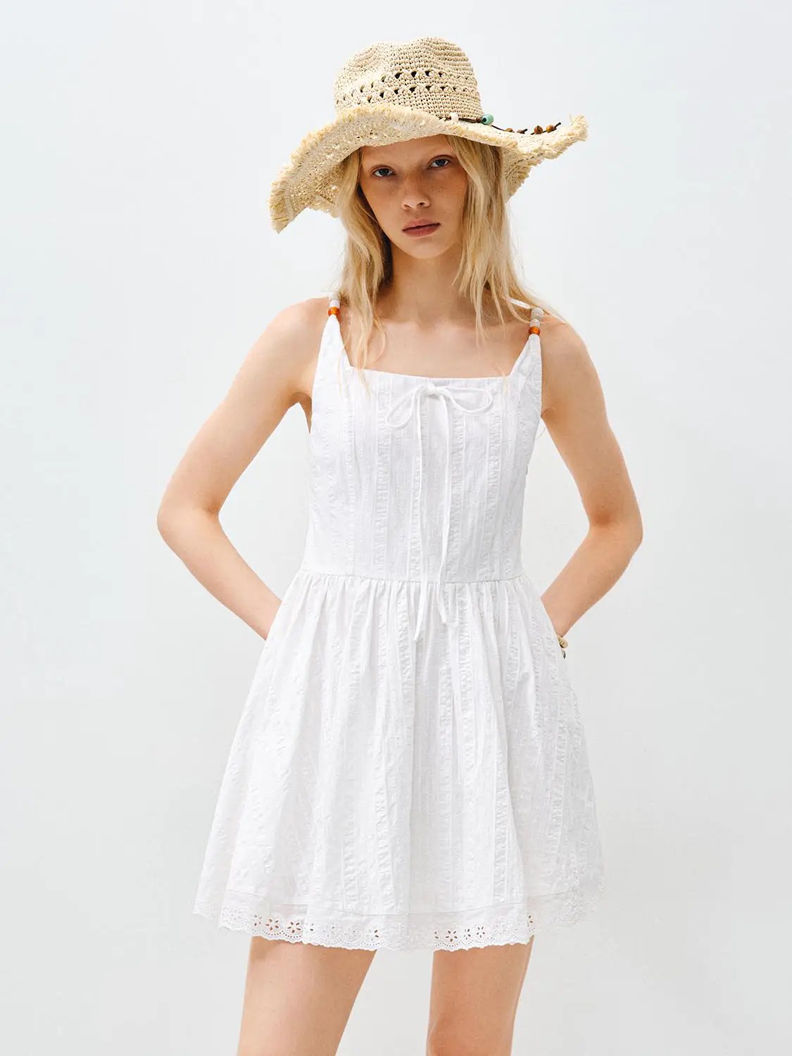 Cotton Lace Dress by Urban Revivo Fashion; white sleeveless knee-length dress with eyelet lace hem.