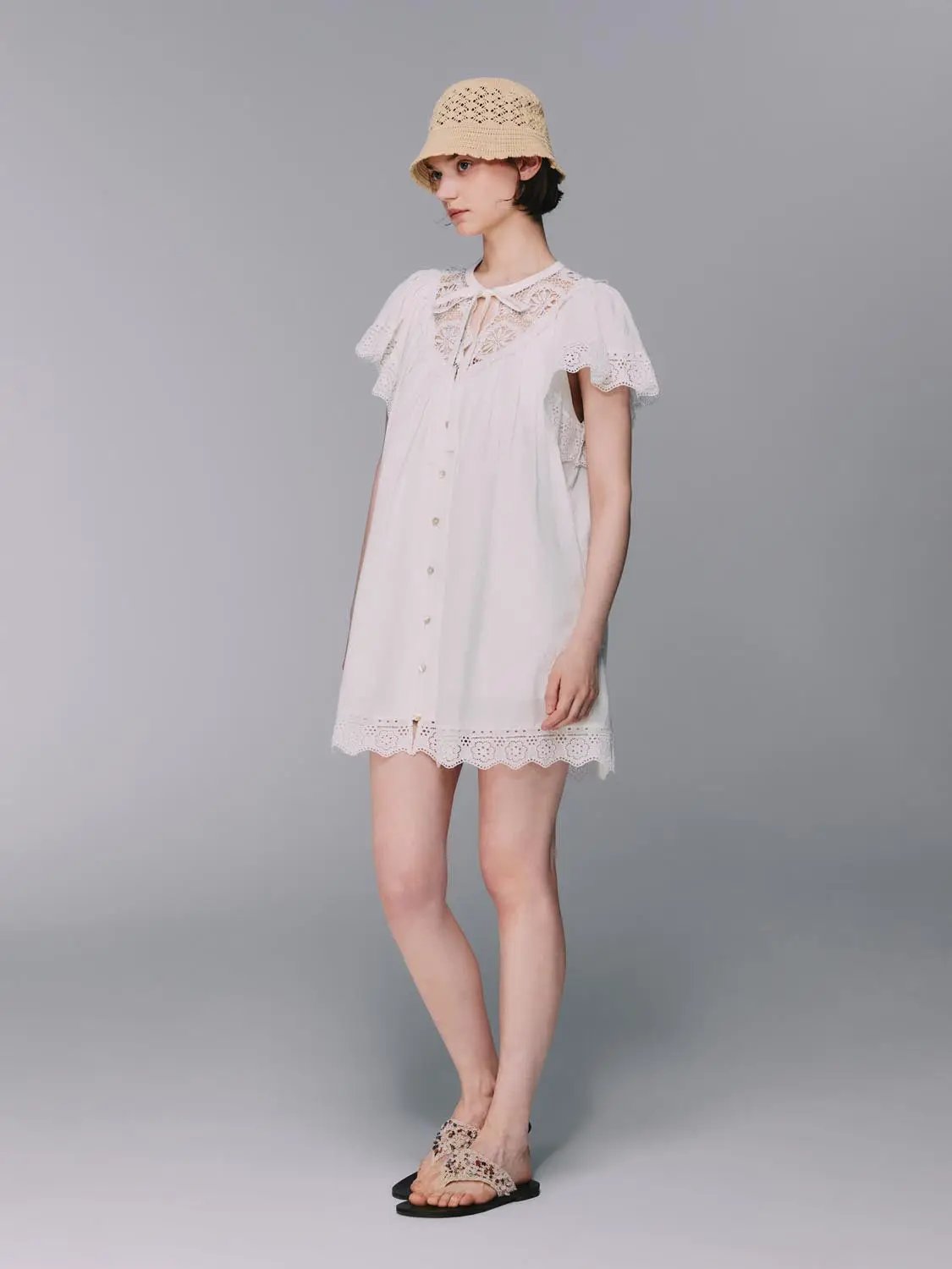 White cotton dress with lace collar, flutter sleeves, scalloped hem and lightweight lining