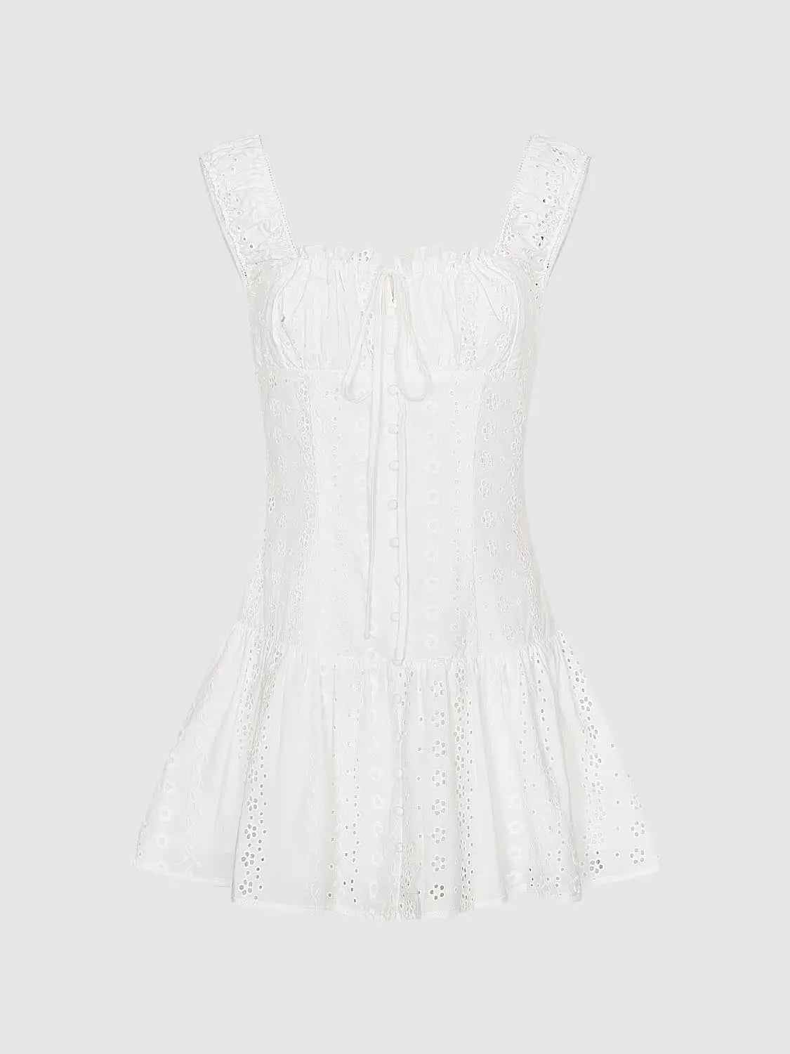 A-Line Dress by Urban Revivo in white eyelet cotton with embroidered floral cutouts, tie-front bodice, wide straps.