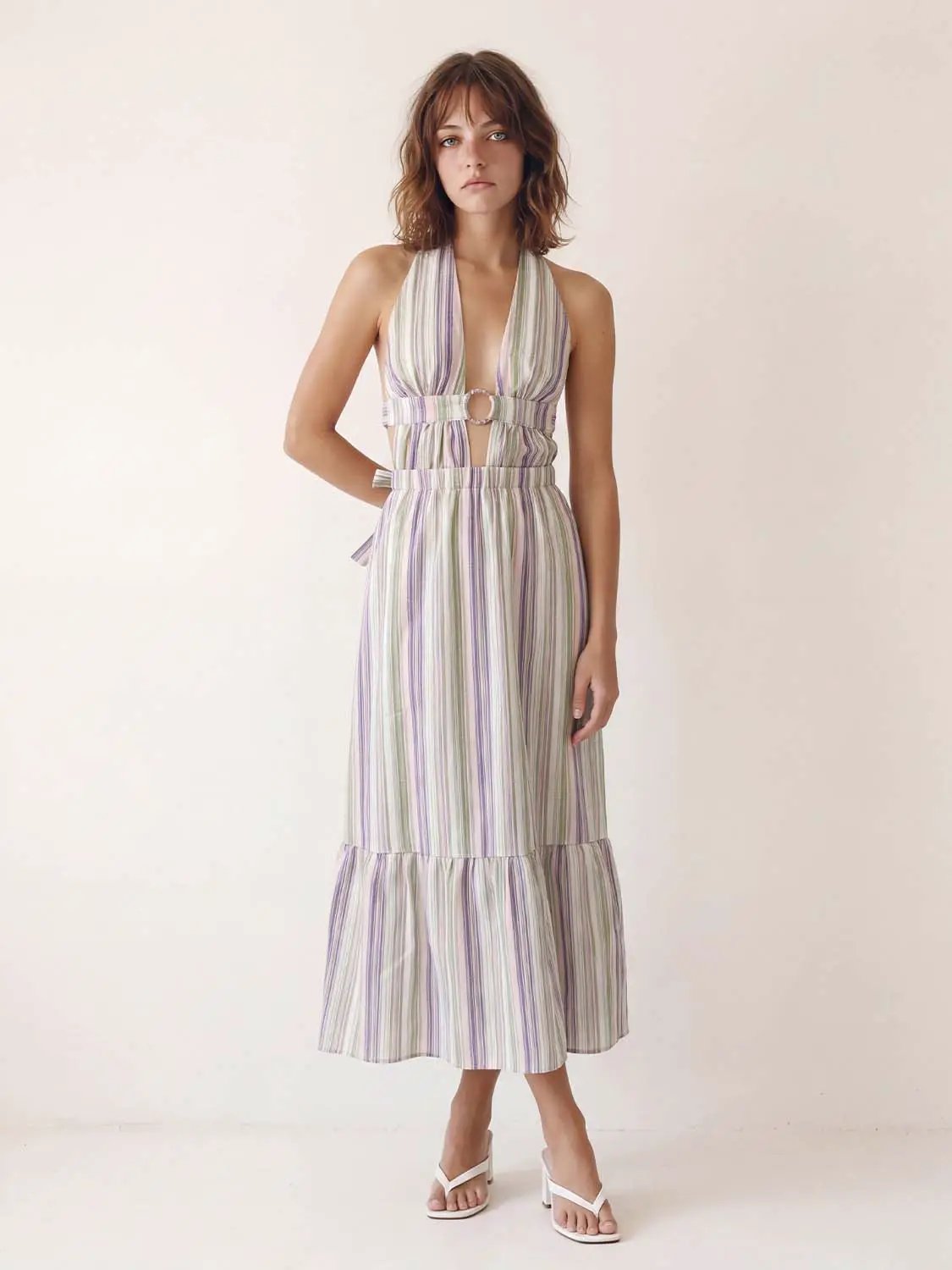 A-Line dress with pastel striped pattern, halter neckline, front cutouts, belt, tiered maxi skirt