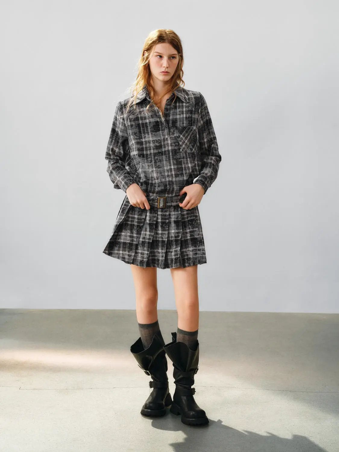A-Line dress in black and gray plaid with belt, above-the-knee length.