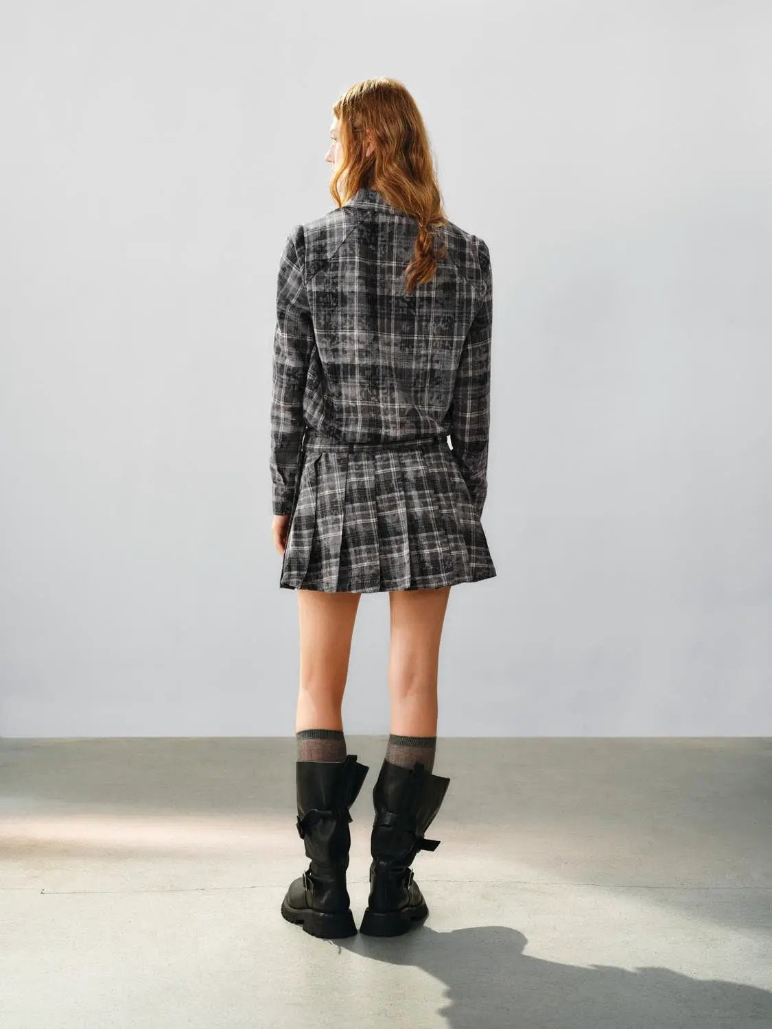 A-line dress in gray plaid with belted waist, back view