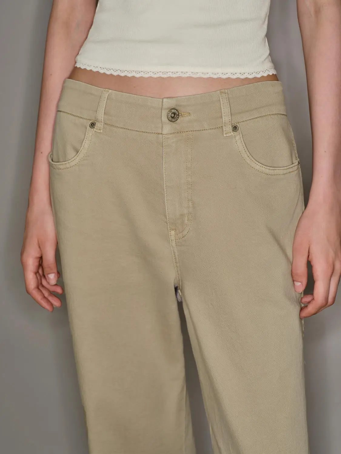 Casual jeans by Urban Revivo Fashion in beige khaki with front pockets and metal button
