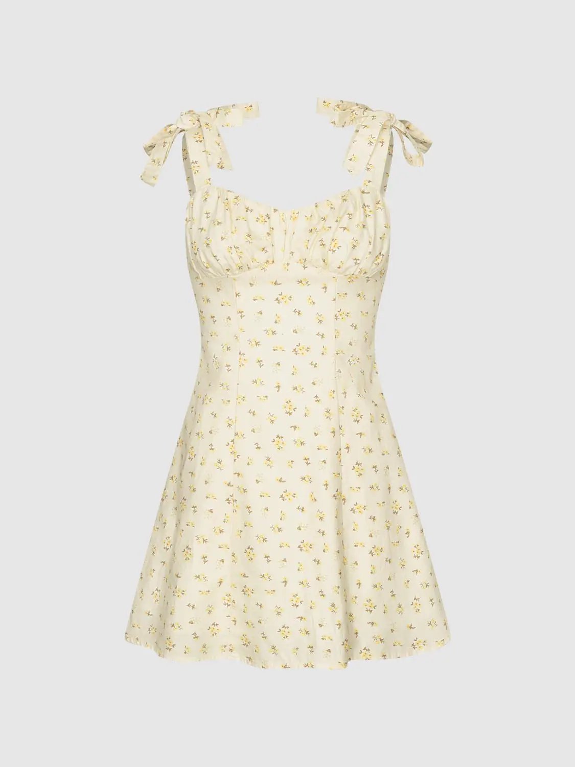 Casual dress with cream floral print and shoulder bow-tie straps