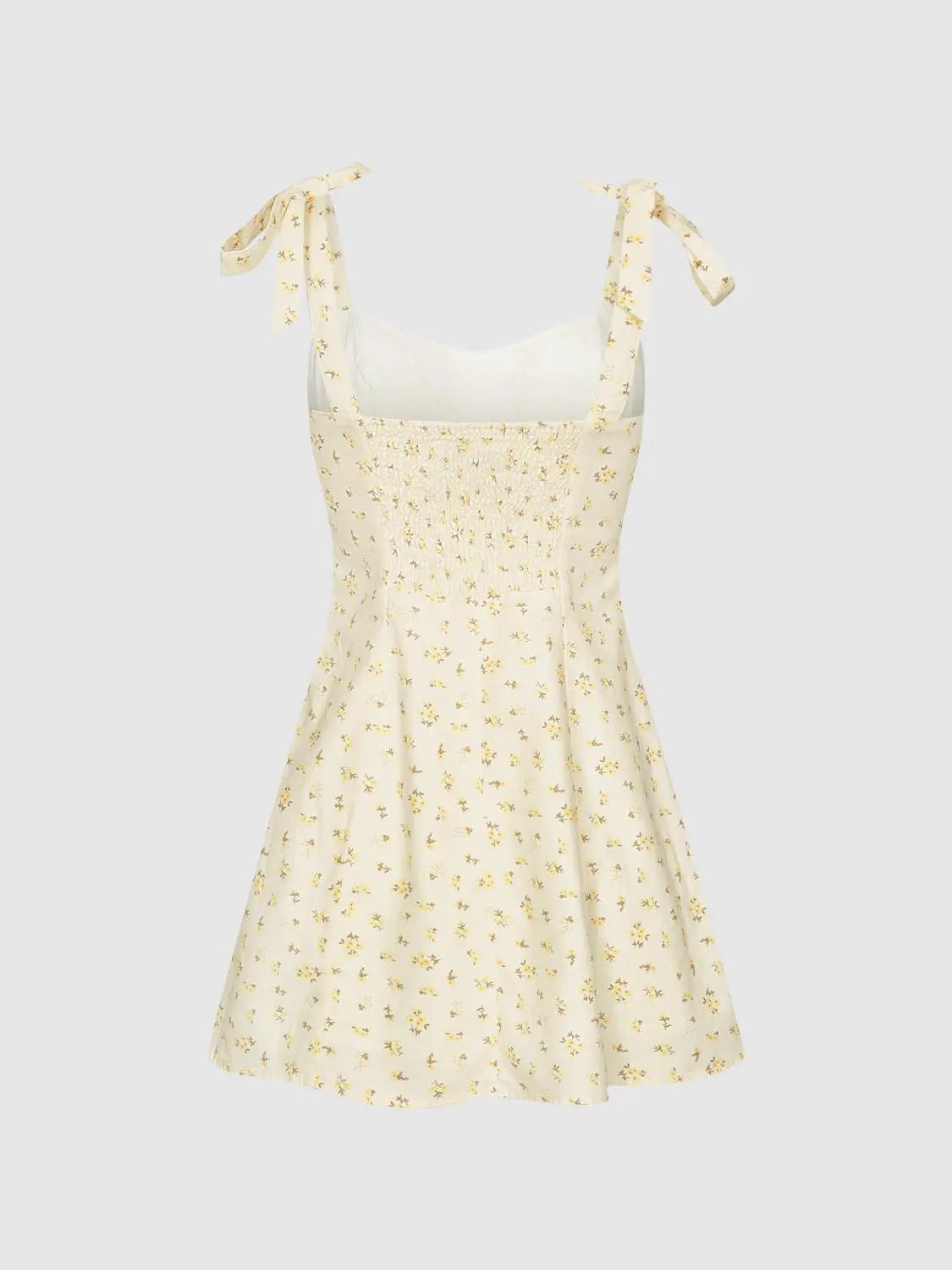 Sundress with cream base, floral print, tie straps, smocked bodice