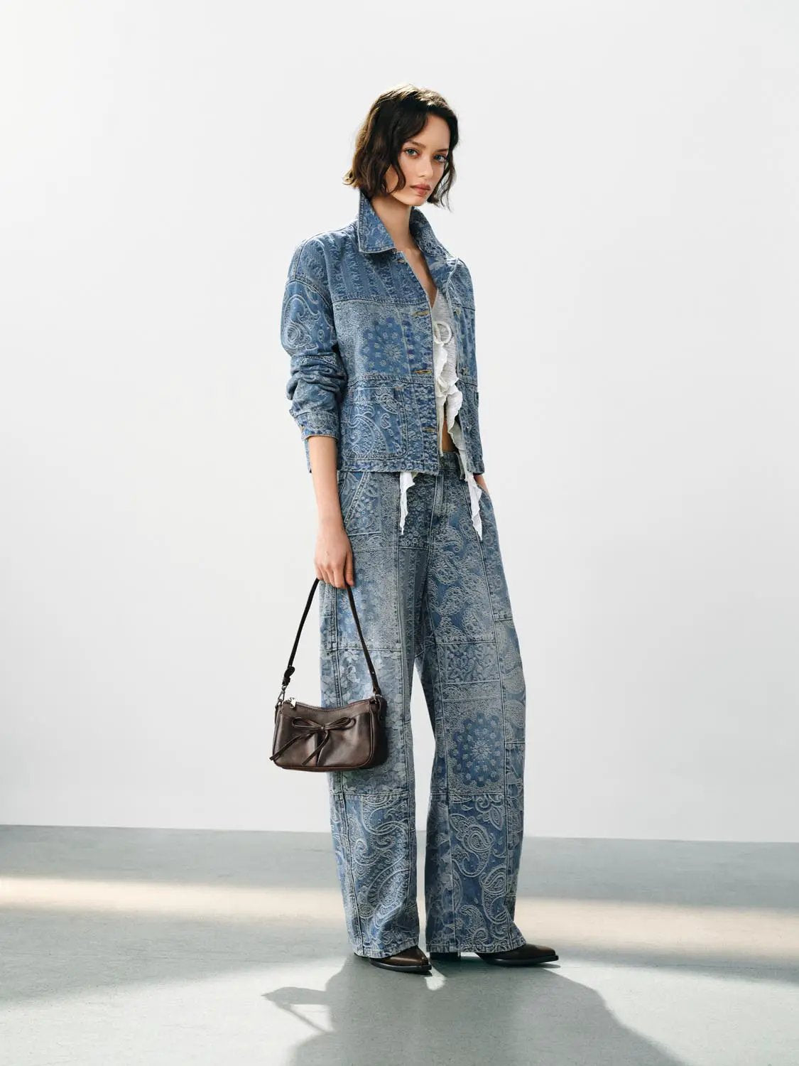 Jeans, blue patchwork denim with a wide-leg cut; paired with a matching denim jacket