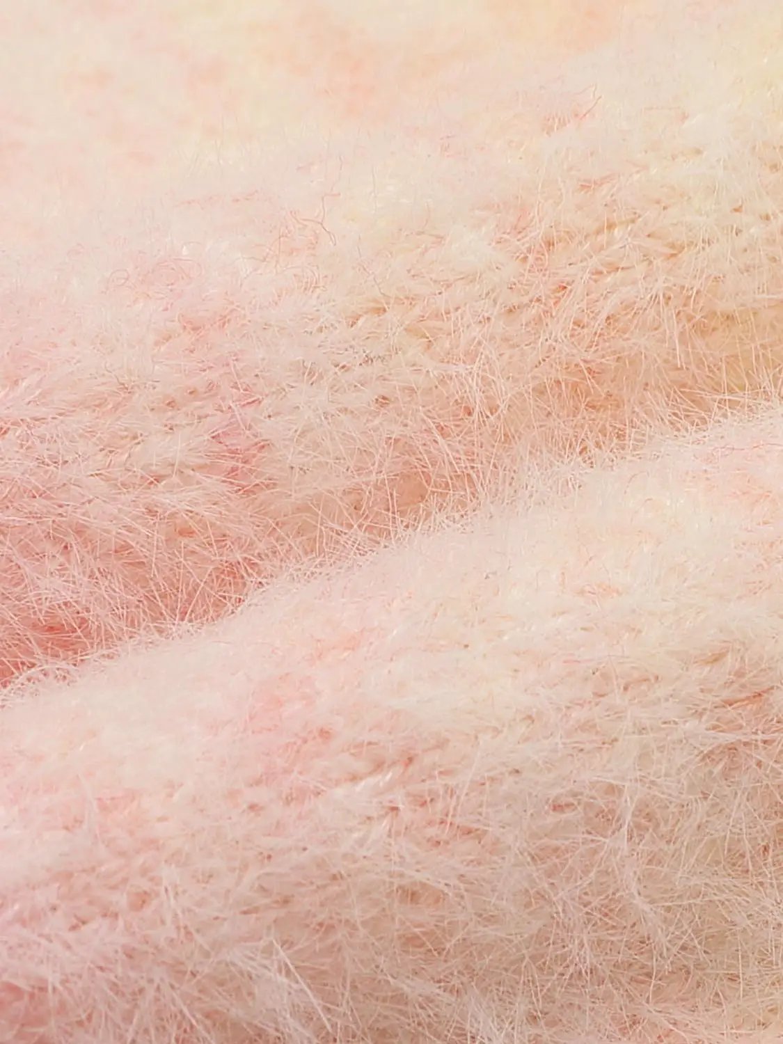 Knitted T-Shirts pink fuzzy fabric close-up texture, soft plush material